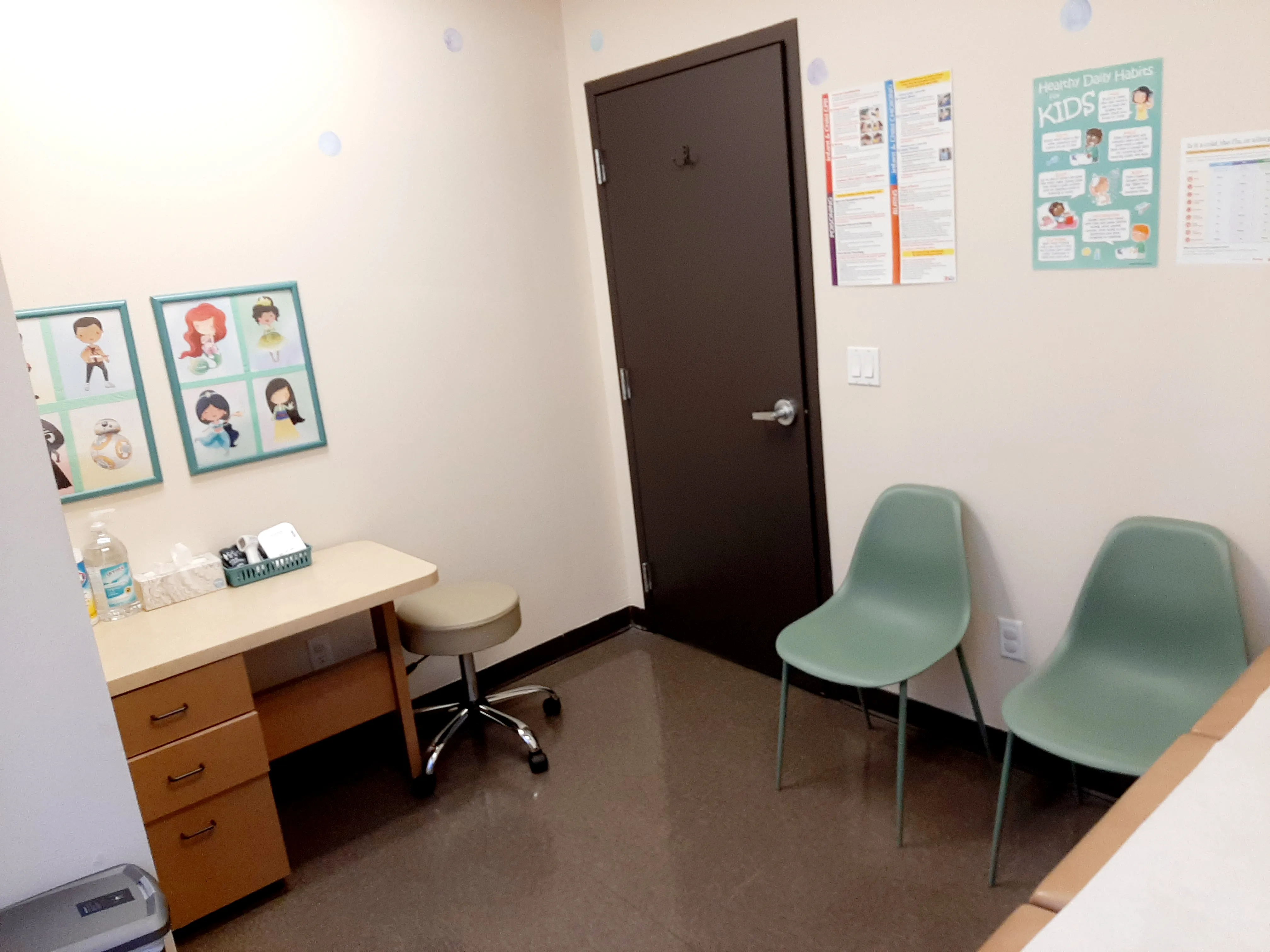 Exam room with friendly character decorations
